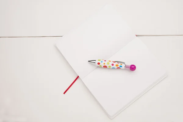Notebook on a white desk — Stock Photo, Image