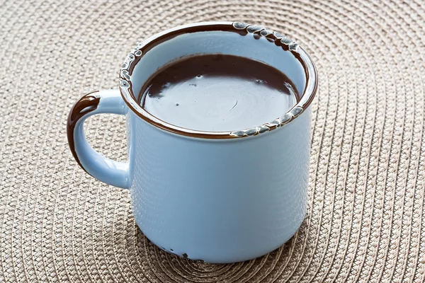 Hot chocolate in blue rustic mug — Stock Photo, Image