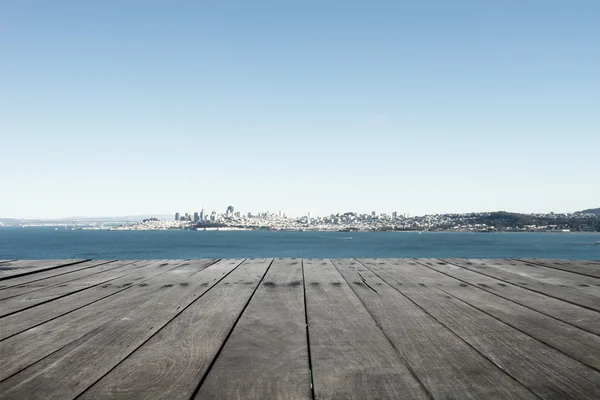 Oude houten vloer met landschap van zee en lucht — Stockfoto