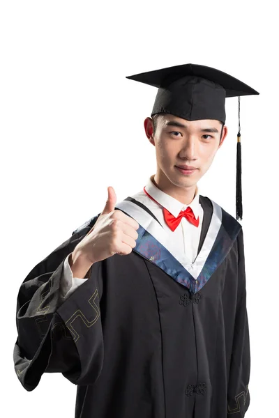 Asian young man in education gown — Stock Photo, Image