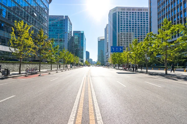 city road through modern buildings in Beijing