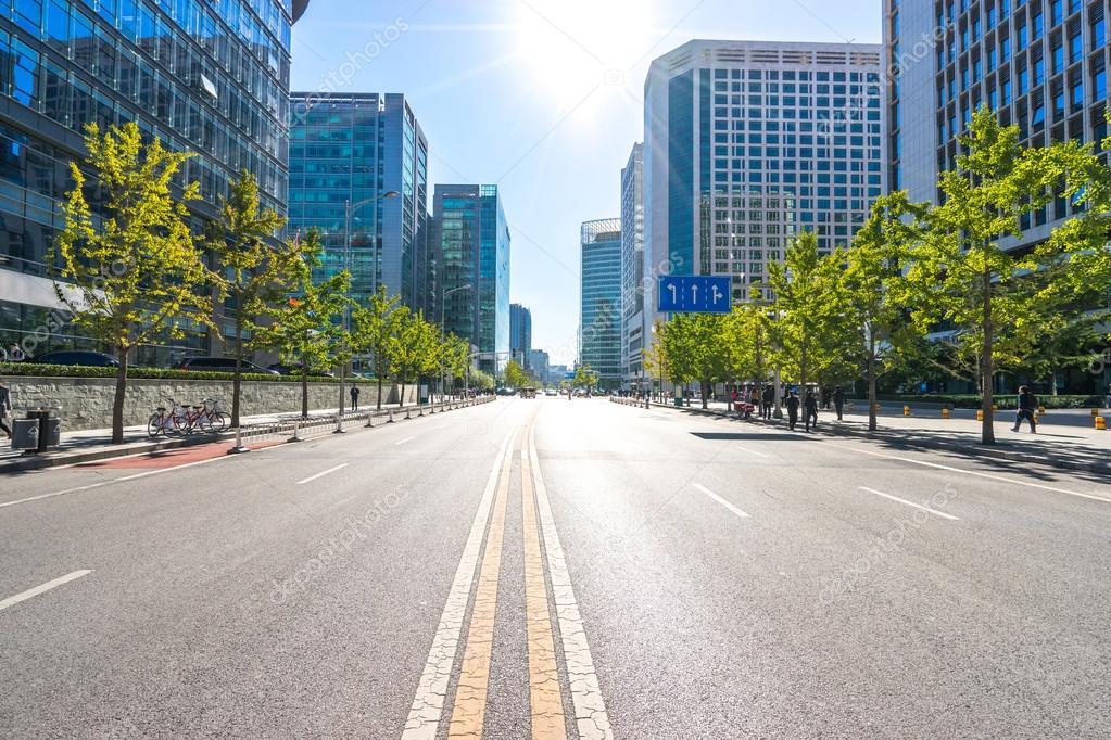 depositphotos_103525994-stock-photo-city-road-through-modern-buildings.jpg