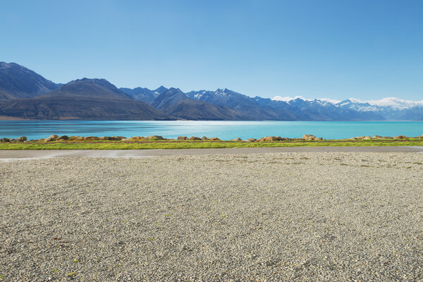 road near lake and snow mountain in New Zealand