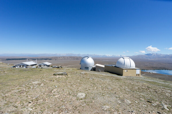 observatory on ground near lake in New Zealand