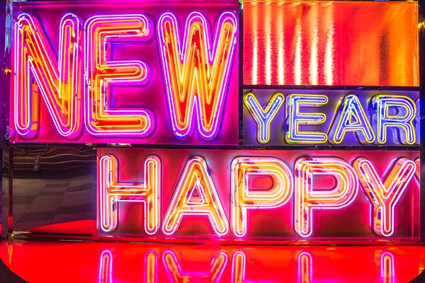 Happy new year by neon light — Stock Photo, Image