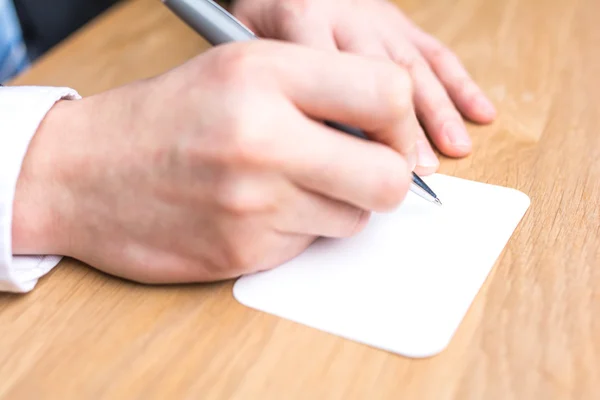 Businessman writing white paper — Stock Photo, Image