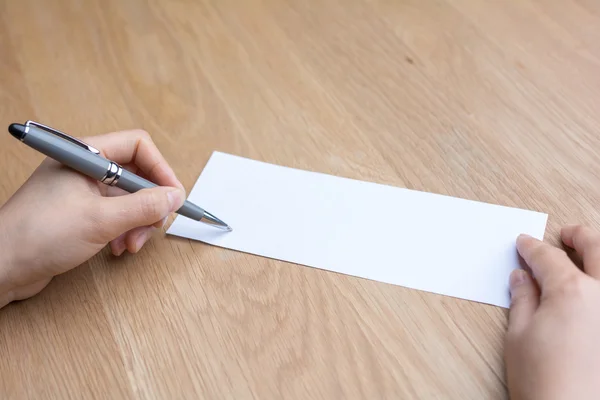Businessman writing on white paper — Stock Photo, Image