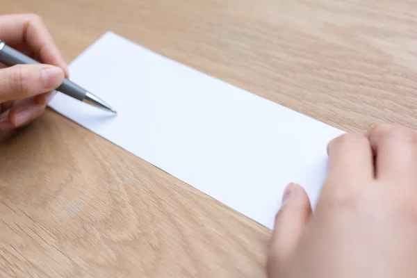 Businessman writing on white paper — Stock Photo, Image