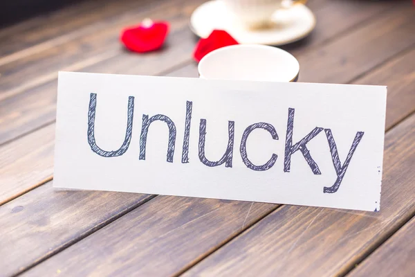 Unlucky to lucky on white paper — Stock Photo, Image