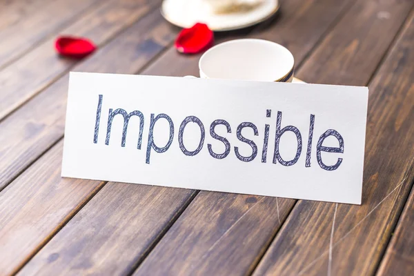 Impossibel to possible on white paper — Stock Photo, Image