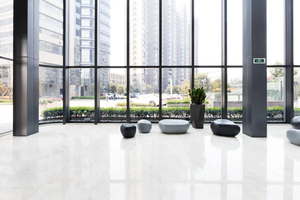 Elegant stools and table in hall — Stock Photo, Image