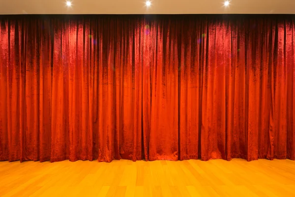 Wood floor with scarlet curtain — Stock Photo, Image