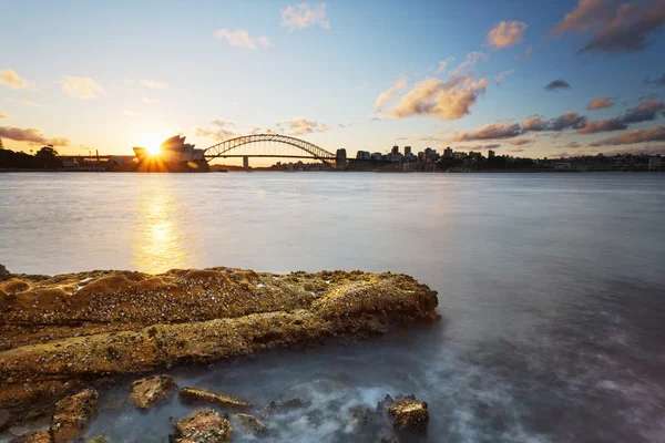 Looking out sydney bridge at sunset — Stock Photo, Image