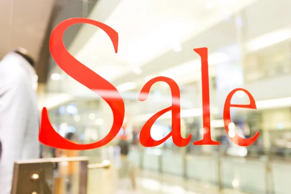 Sale sign  on the shop window — Stock Photo, Image