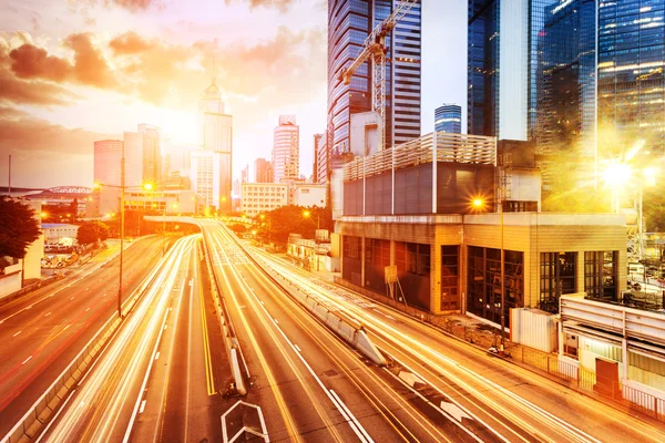 Cityscape and traffic trails on the road of modern city — Stock Photo, Image