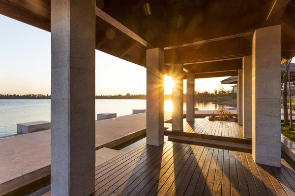 Resort lakeside pavilion at sunset — Stock Photo, Image