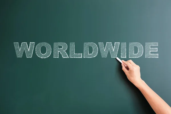 Worldwide written on blackboard — Stock Photo, Image