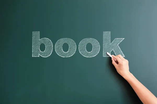 Boek geschreven op blackboard — Stockfoto