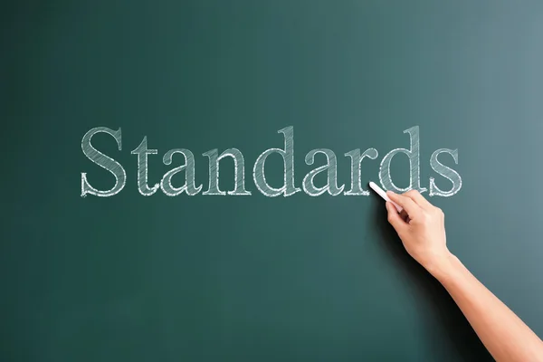 Standards written on blackboard — Stock Photo, Image