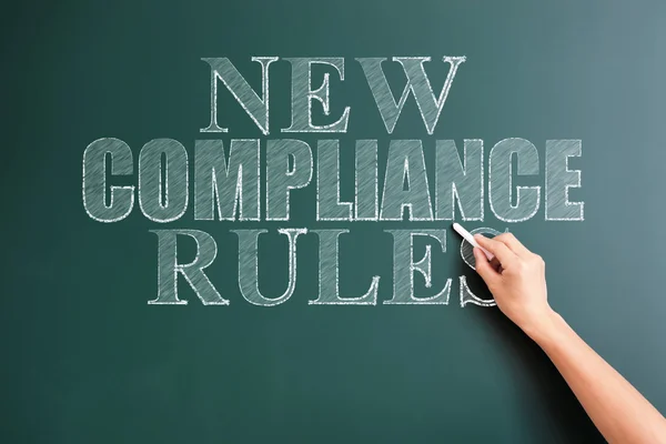 Hand written words new compliance rules — Stock Photo, Image