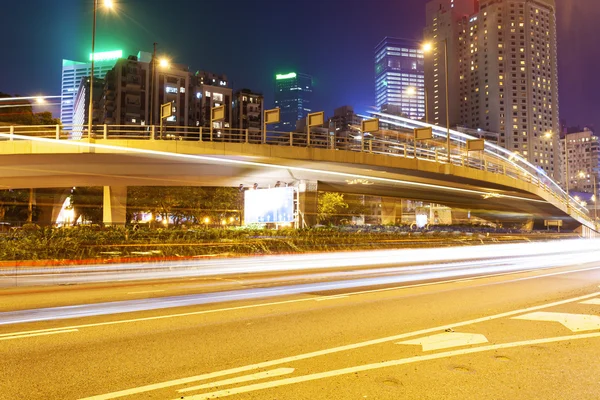 Traffic blur motion trails in modern city street at night — Stock Photo, Image