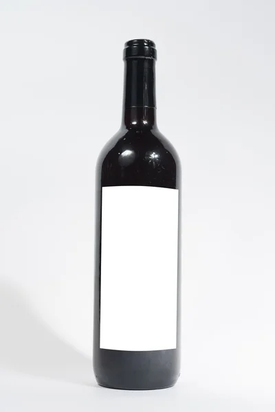 Бутылка вина с пустой этикеткой — стоковое фото