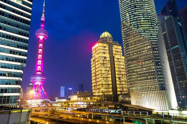 Skyscrapers in modern city at night — Stock Photo, Image