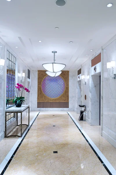 Hotel decorated corridor with elevator — Stock Photo, Image