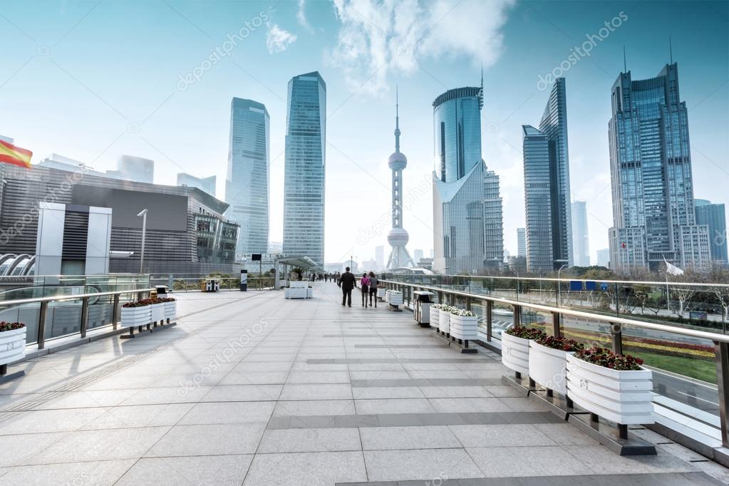 Empty footpath with modern skyline and buildings