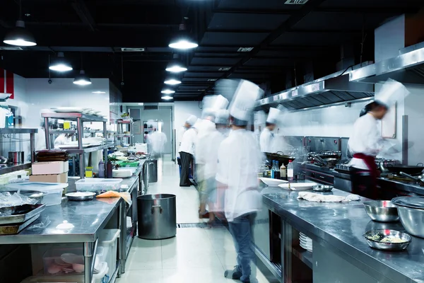 Modern kitchen and busy chefs in hotel — Stock Photo, Image