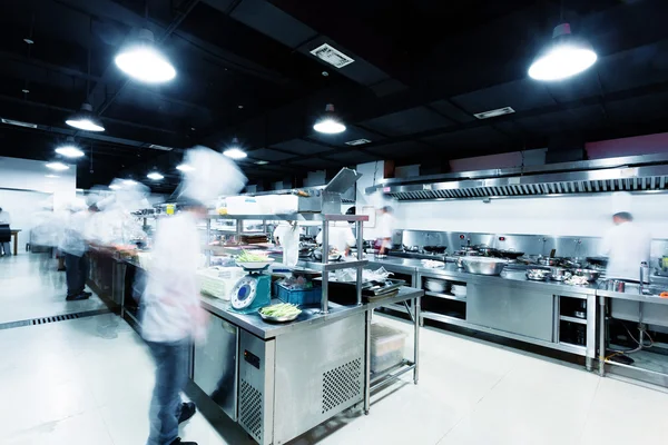 Modern kitchen and busy chefs in hotel — Stock Photo, Image