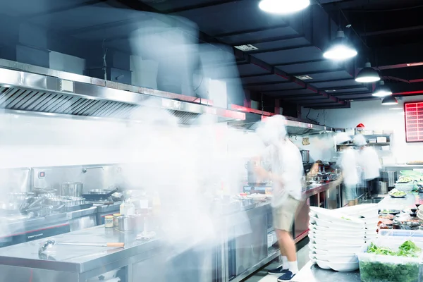 Modern kitchen and busy chefs in hotel — Stock Photo, Image