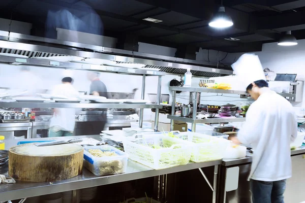 Modern kitchen and busy chefs — Stock Photo, Image