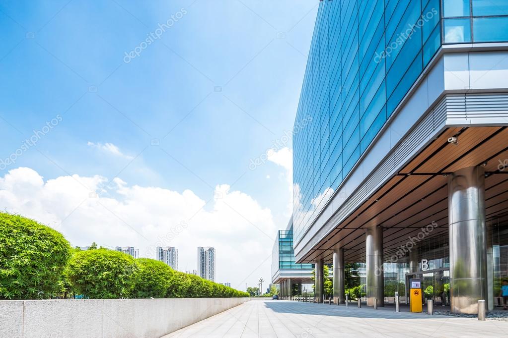 Empty road near modern building exterior