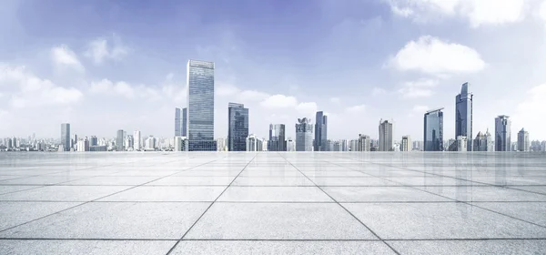 Empty floor with modern skyline and buildings — Stock Photo, Image