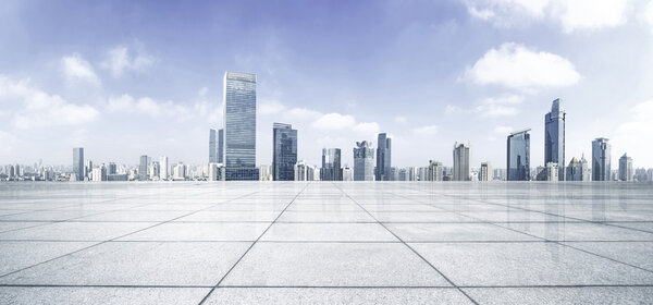 Empty floor with modern skyline and buildings