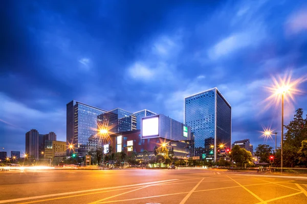 Light trails in modern city street — Stock Photo, Image