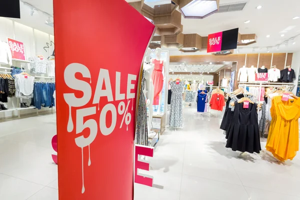 Sale sign in clothes shop — Stock Photo, Image