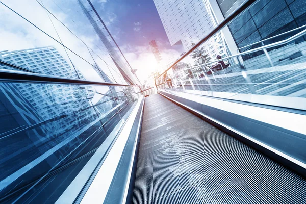 Fast escalator and sunbeam — Stock Photo, Image