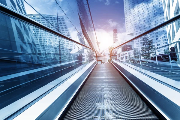 Fast escalator and sunbeam — Stock Photo, Image