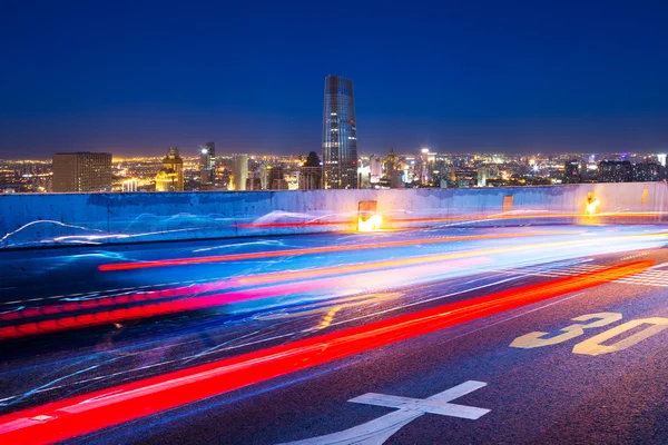 Traffic light trails in modern street — Stock Photo, Image