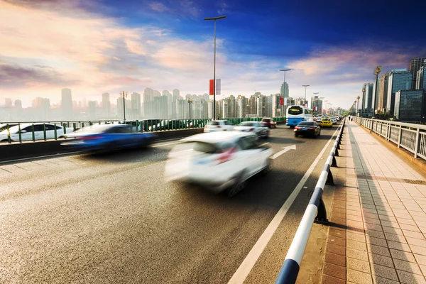 Traffic blur motion on bridge with skyline — Stock Photo, Image