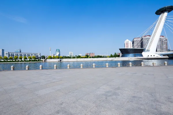 Modern city skyline with empty road floor — Stock Photo, Image