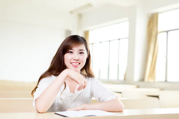 Asian female student studying in classroom — Stock Photo, Image