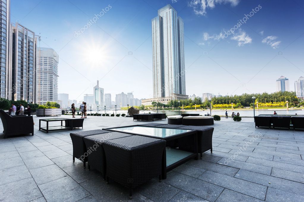 Modern buildings and public square with seats