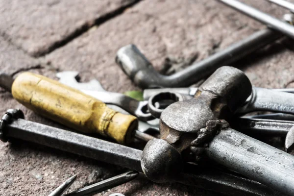Work tools on brick ground — Stock Photo, Image