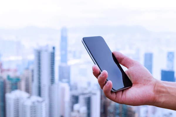 Hand holding mobile phone — Stock Photo, Image