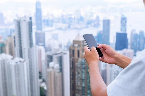 Hand holding mobile phone — Stock Photo, Image