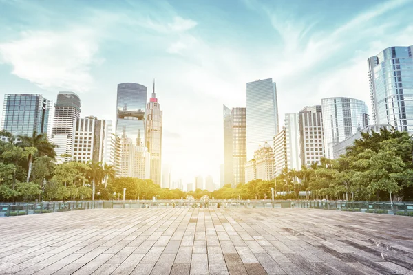 Modern square and skyscrapers under sunbeam — Stock Photo, Image