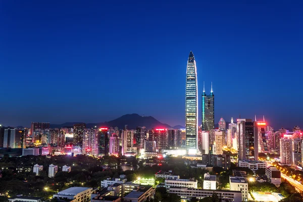 Panorama of skyscrapers in a modern city at night — Stock Photo, Image